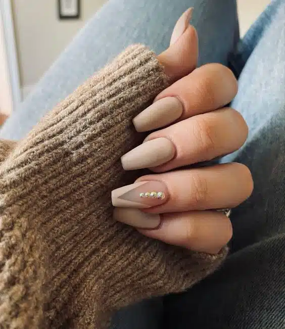 Nude with gems nails