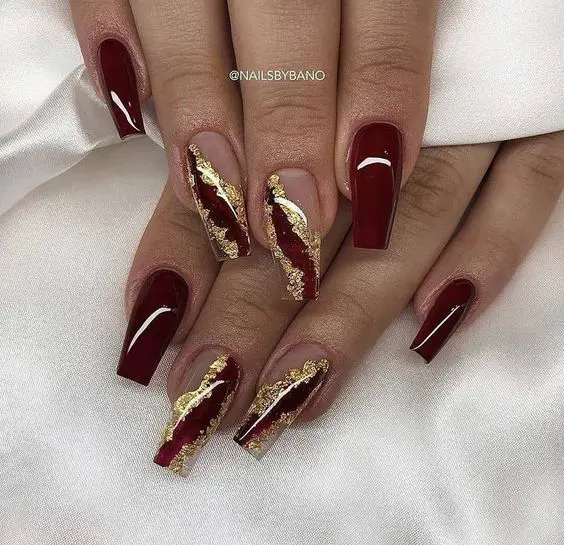 gold and dark red nails