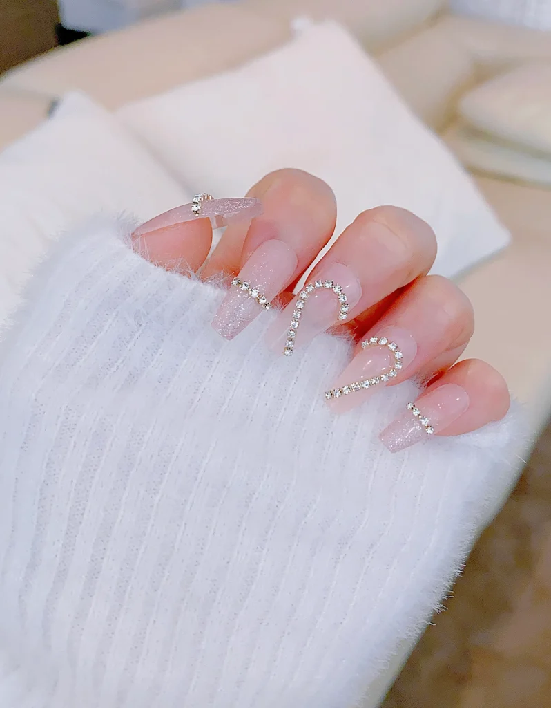 Pink glitter heart nails